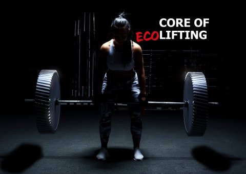 A woman lifting weights in a dark room, with a text 