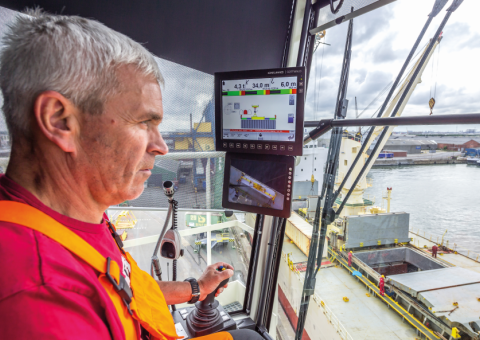 Operator in Mobile harbor crane cabin